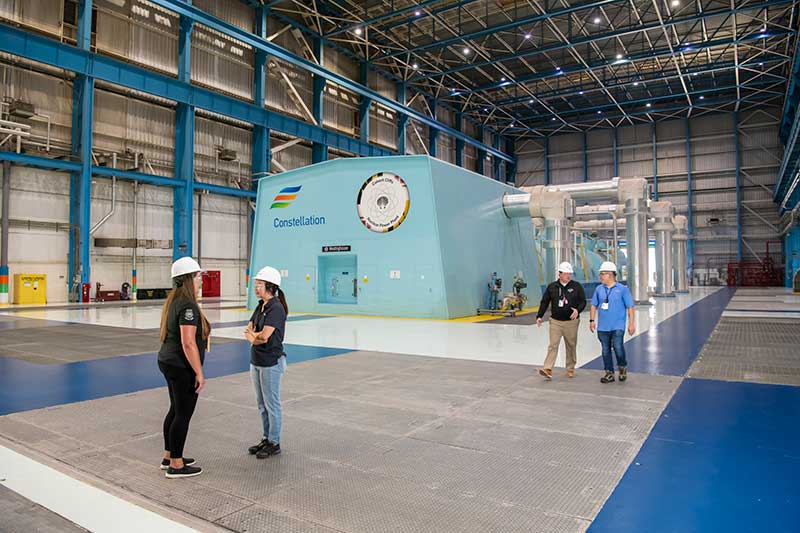 Constellation turbine generator inside Calvert Cliffs Clean Energy Center with workers nearby