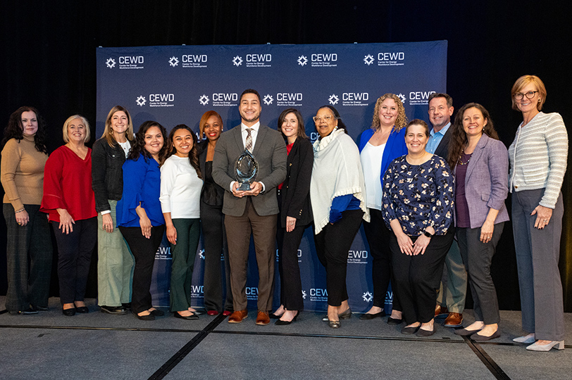 Six achievement logos for IMPACT Awards, Reuters, JUST100 DNV, Barron's and Great Place to Work