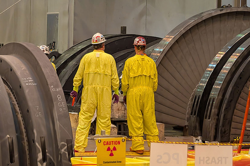 men inspecting turbine