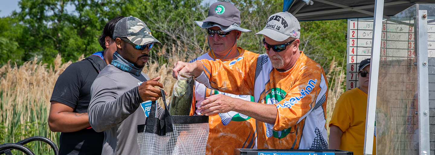 Fishing for a cure men holding fish