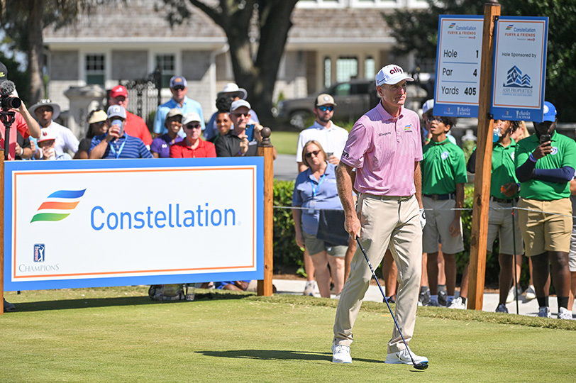 Furyk & Friends golf tournament with Jim Furyk walking off the tee, sponsored by Constellaton