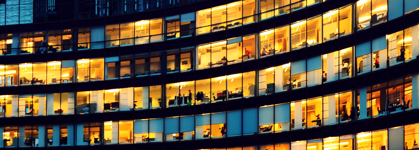 Commerical builidng at night with lights on and off