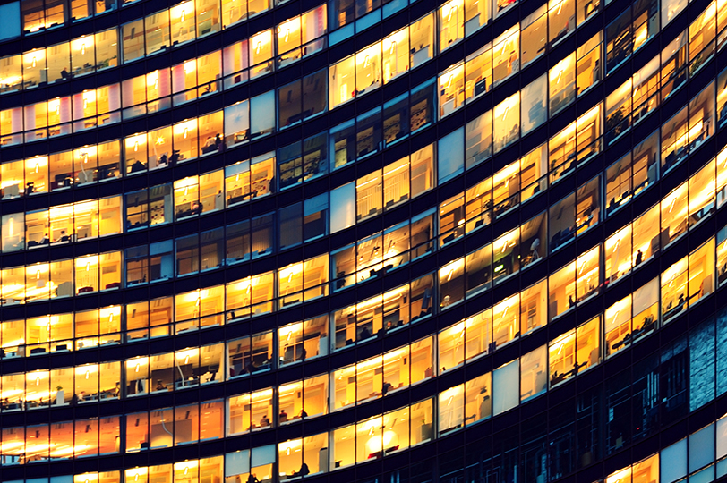 building with lights on and off