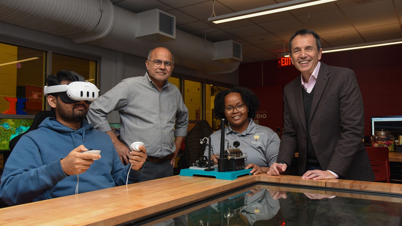 Professors Rizwan Uddin (standing, left), Leon Liebenberg (standing, right) and students from University of Illinois Urbana-Champaign demonstrate the virtual reality experience as part of the university's ReGen Lab