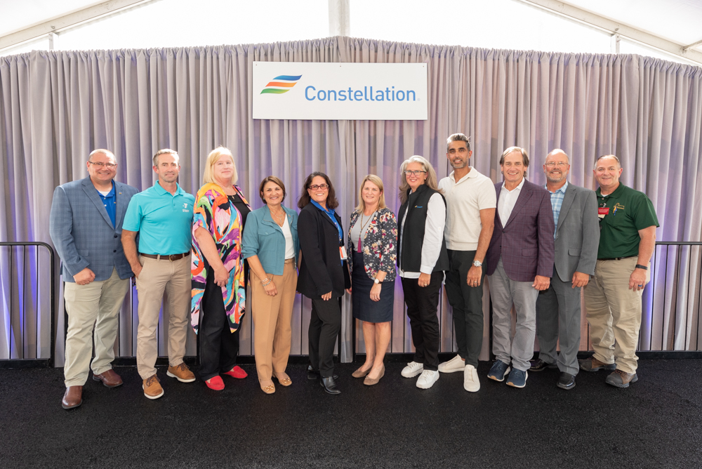 group shot on stage at clinton clean energy center