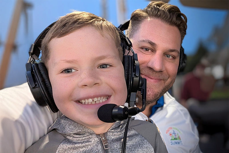 Father and son with headphones on